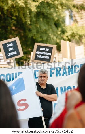 STRASBOURG, FRANCE - JULY 11, 2015: Uyghur human rights activists participate in a demonstration to protest against Chinese government's policy in Uyghur