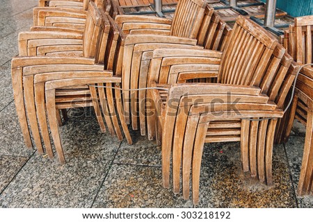 Street cafe chairs and tables turned upside down in France