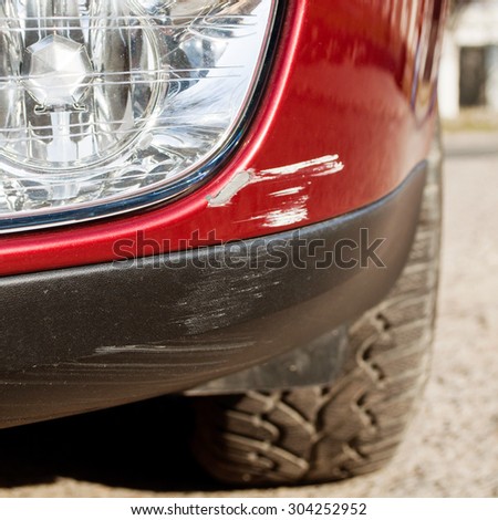 Scratch on a car's bumper - right under the headlight after accident