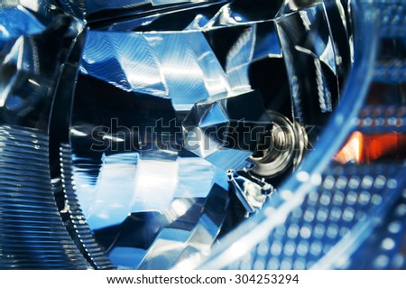Car headlight extreme close-up with mirror reflection - xenon, led