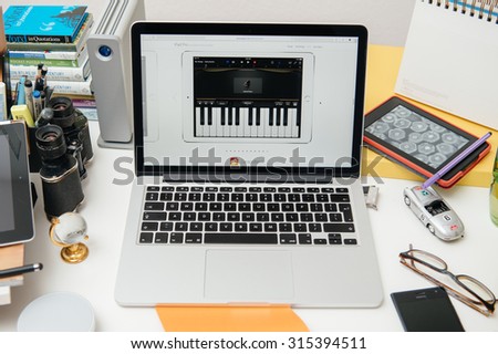 PARIS, FRANCE - SEP 10, 2015: Apple Computers website on MacBook Pro Retina in a creative room environment showcasing the newly announced iPad Pro with garage Band
