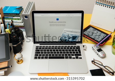 PARIS, FRANCE - SEP 10, 2015: Apple Computers website on MacBook Pro Retina in a creative room environment showcasing the newly announced iPad Pro and its productivity
