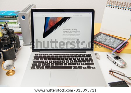 PARIS, FRANCE - SEP 10, 2015: Apple Computers website on MacBook Pro Retina in a creative room environment showcasing the newly announced iPad Pro with Touch ID
