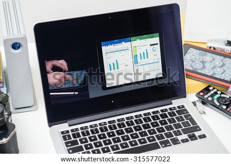 PARIS, FRANCE - SEP 10, 2015: Apple Computers website on MacBook Pro Retina in a creative room environment showcasing the newly announced iPad Pro and Microsoft Office