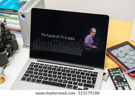 PARIS, FRANCE - SEP 10, 2015: Apple Computers website on MacBook Pro Retina in a creative room environment with Tim Cook and The future of TV is Apps