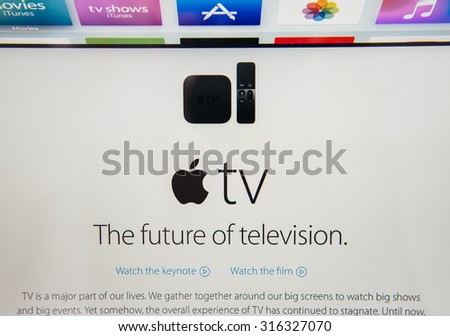 PARIS, FRANCE - SEP 10, 2015: Apple Computers website on MacBook Pro Retina in a creative room environment showcasing the newly announced Apple TV, the future of television