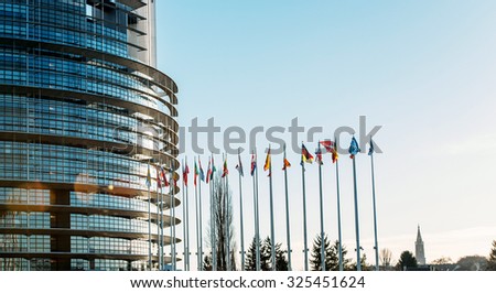 Row of all European Union Flags in Strasbourg, France at the European parliament on a clear sky day
