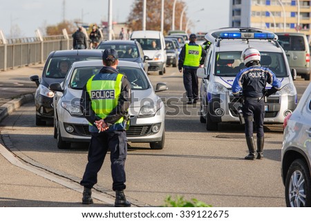 STRASBOURG, FRANCE - NOV 14 2015: French Police checking vehicles on the \'Bridge of Europe\' between Strasbourg and Kehl Germany, after attacks in Paris - police inspecting every car