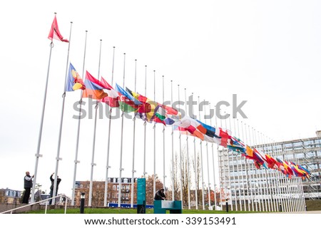 STRASBOURG, FRANCE - 14 Nov 2015: All European Union Flag flies at half-mast in front of the Council of Europe following an terrorist attack in Paris