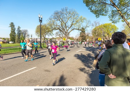 Washington DC, USA - Apr.12, 2015 : Joggers and runners participated in the event of Credit Union Cherry Blossom 5K run-walk