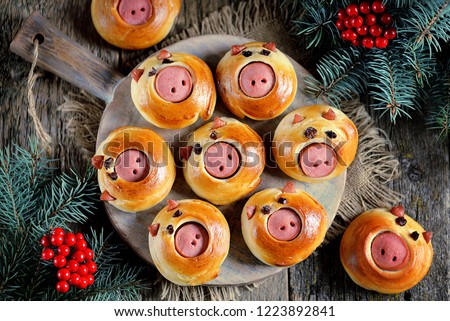 Cute pig buns with sausages - symbol of 2019, the idea for children\'s breakfast.