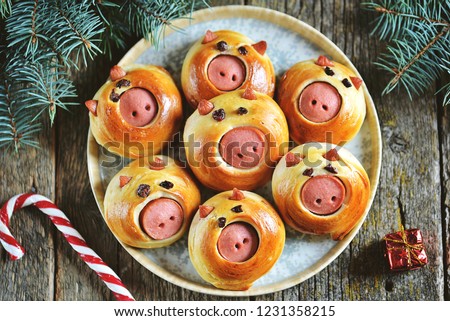 Cute pig buns with sausages - symbol of 2019, the idea for children\'s breakfast. Top view.
