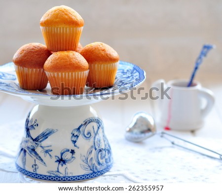 Delicious cupcakes on table on white background