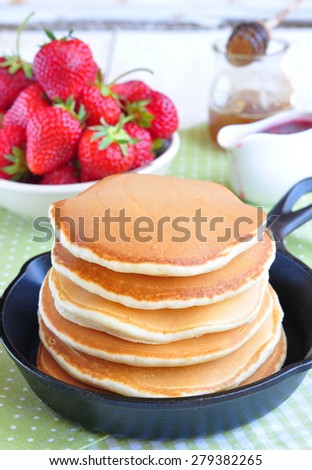 pancakes with fresh strawberry  in a small pan
