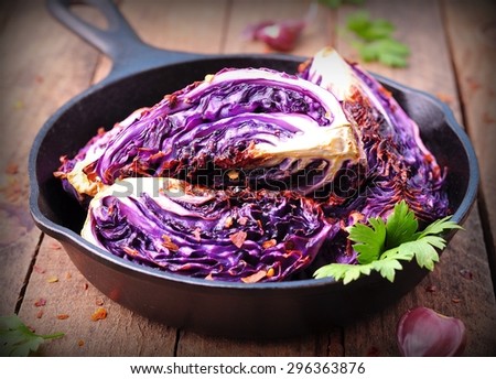 organic red cabbage baked in olive oil with chili pepper flakes and sea salt. vegetarian food.  image is tinted