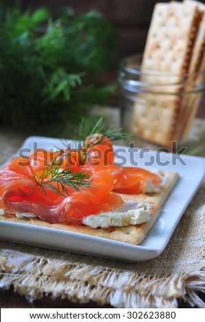 crackers with cheese curd, pickled salmon and dill