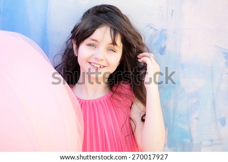 Pretty little girl smiling and looking forward, horizontal picture