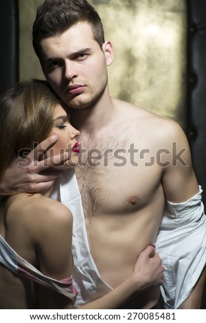Hot young couple with beautiful bodies, vertical picture