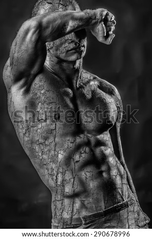 Handsome shirtless man torso with bark texture