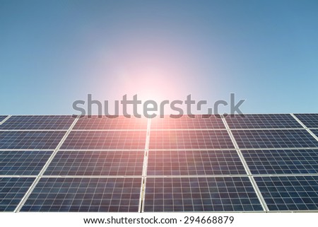 Solar battery with highlight on unflawed blue sky background copyspace, horizontal picture