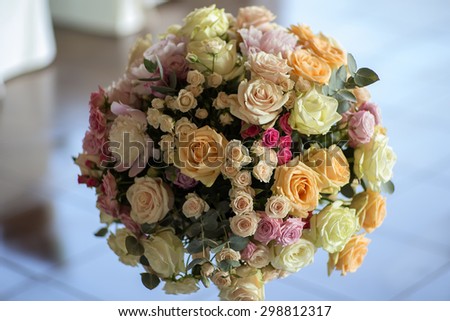 Decorate wedding bunch of fresh beautiful flowers of roses and peony white pink violet purple yellow lilac and orange colours round shape indoor, horizontal picture