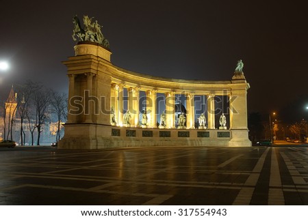 BUDAPEST - DECEMBER 12, 2012: Side view on Heroes\' Square monument illuminated in evening, one of the major squares in Budapest, Hungary