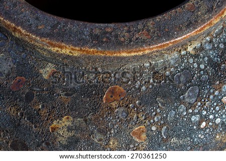 Rustic looking pot shot in an abstract way with dark opening at the top.