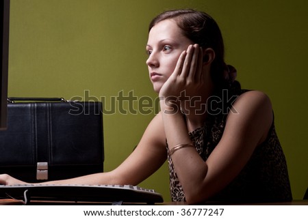 Serious lady looking at dasplay