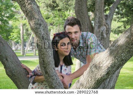 a young married couple on vacation in the Park