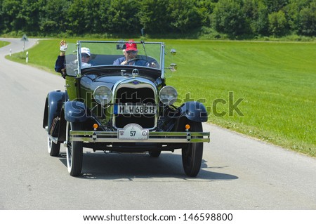 LANDSBERG, GERMANY - JULY 12: Oldtimer rallye for at least 80 years old antique cars with Ford A Cabriolet, built at year 1928, photo taken on July 12, 2013 in Landsberg, Germany