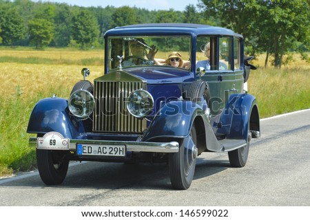 LANDSBERG, GERMANY - JULY 13: Oldtimer rallye for at least 80 years old antique cars with Rolls Royce Landaulet 20/25, built at year 1930, photo taken on July 13, 2013 in Landsberg, Germany