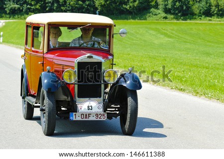 LANDSBERG, GERMANY - JULY 12: Oldtimer rallye for at least 80 years old antique cars with Peugeot 201 Berlin, built at year 1929, photo taken on July 12, 2013 in Landsberg, Germany