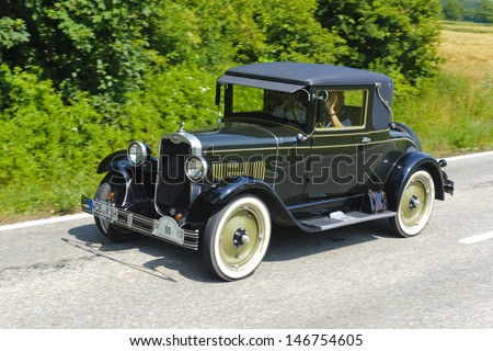 LANDSBERG, GERMANY - JULY 13: Oldtimer rallye for at least 80 years old antique cars withChevrolet National AB Coupe, built at year 1928, photo taken on July 13, 2013 in Landsberg, Germany