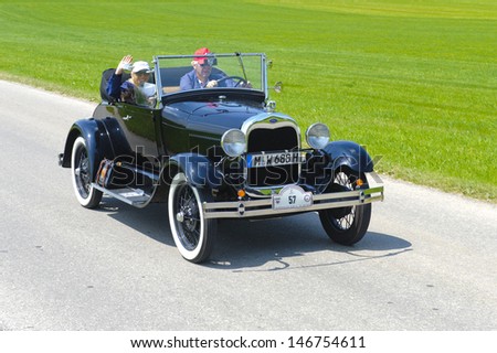 LANDSBERG, GERMANY - JULY 12: Oldtimer rallye for at least 80 years old antique cars with Ford A Cabriolet, built at year 1928, photo taken on July 12, 2013 in Landsberg, Germany