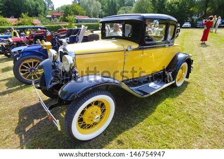 LANDSBERG, GERMANY - JULY 13: Oldtimer rallye for at least 80 years old antique cars with Ford A Coupe, built at year 1930, photo taken on July 13, 2013 in Landsberg, Germany