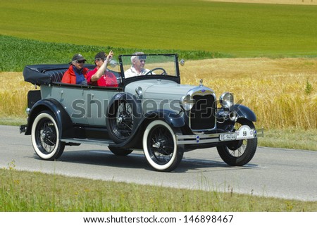 LANDSBERG, GERMANY - JULY 13: Oldtimer rallye for at least 80 years old antique cars with Ford A Phaeton, built at year 1929, photo taken on July 13, 2013 in Landsberg, Germany