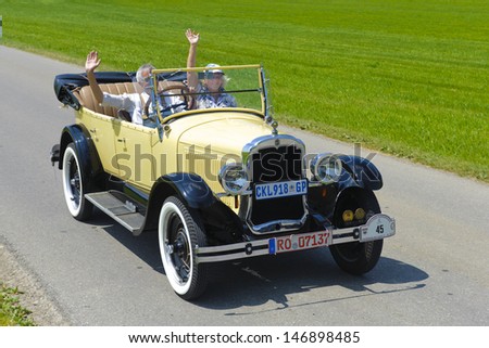 LANDSBERG, GERMANY - JULY 12: Oldtimer rallye for at least 80 years old antique cars with Oldsmobile, built at year 1924, photo taken on July 12, 2013 in Landsberg, Germany