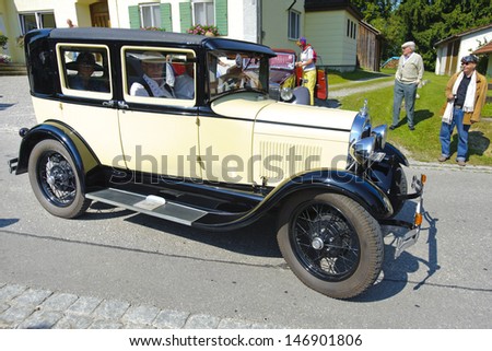 LANDSBERG, GERMANY - JULY 12: Oldtimer rallye for at least 80 years old antique cars with Ford A, built at year 1928, photo taken on July 12, 2013 in Landsberg, Germany