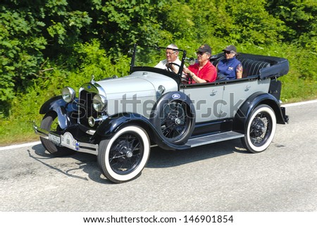 LANDSBERG, GERMANY - JULY 13: Oldtimer rallye for at least 80 years old antique cars with Ford A Phaeton, built at year 1929, photo taken on July 13, 2013 in Landsberg, Germany
