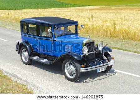 LANDSBERG, GERMANY - JULY 13: Oldtimer rallye for at least 80 years old antique cars with Chevrolet Sedan AD Universal, built at year 1930, photo taken on July 13, 2013 in Landsberg, Germany