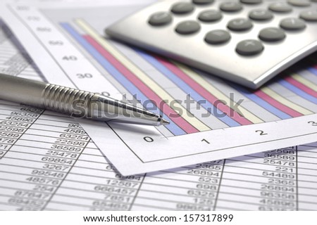 finance business calculation with calculator, chart and pen