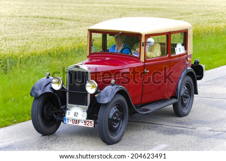 LANDSBERG, GERMANY - JULY 12, 2014: Public oldtimer rally organized by Bavarian city Landsberg for at least 80 years old veteran cars with unknown drivers in Peugeot 201, built at year 1929.