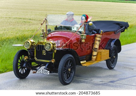 LANDSBERG, GERMANY - JULY 12, 2014: Public oldtimer rally organized by Bavarian city Landsberg for at least 80 years old veteran cars with unknown drivers in Rochet-Schneider 11000, built at year 1912
