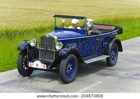 LANDSBERG, GERMANY - JULY 12, 2014: Public oldtimer rally organized by Bavarian city Landsberg for at least 80 years old veteran cars with unknown drivers in Wanderer W10, built at year 1927
