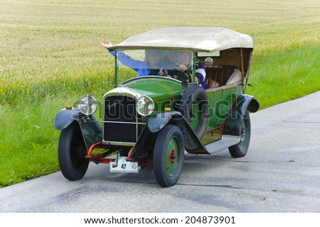 LANDSBERG, GERMANY - JULY 12, 2014: Public oldtimer rally organized by Bavarian city Landsberg for at least 80 years old veteran cars with unknown drivers in Peugeot BL, built at year 1923