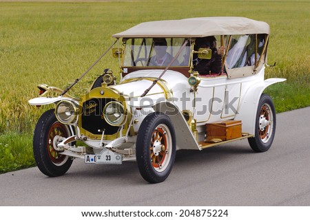 LANDSBERG, GERMANY - JULY 12, 2014: Public oldtimer rally organized by Bavarian city Landsberg for at least 80 years old veteran cars with unknown drivers in De Dion Bouton, built at year 1912