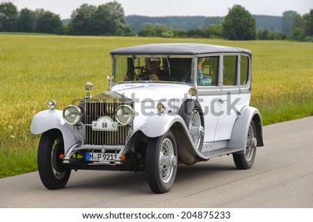 LANDSBERG, GERMANY - JULY 12, 2014: Public oldtimer rally organized by Bavarian city Landsberg for at least 80 years old veteran cars with unknown drivers in Rolls Royce Phantom I, built at year 1928