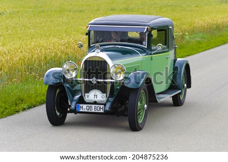 LANDSBERG, GERMANY - JULY 12, 2014: Public oldtimer rally organized by Bavarian city Landsberg for at least 80 years old veteran cars with unknown drivers in Hotchkiss AM 80 Coupe, built at year 1930