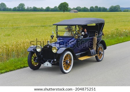 LANDSBERG, GERMANY - JULY 12, 2014: Public oldtimer rally organized by Bavarian city Landsberg for at least 80 years old veteran cars with unknown drivers in Buick 45 D, built at year 1915