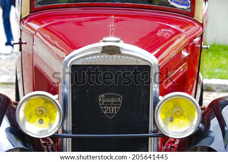 LANDSBERG, GERMANY - JULY 12, 2014: Public oldtimer rally in Bavarian city Landsberg for at least 80 years old veteran cars with a front view of Peugeot 201, built at year 1929